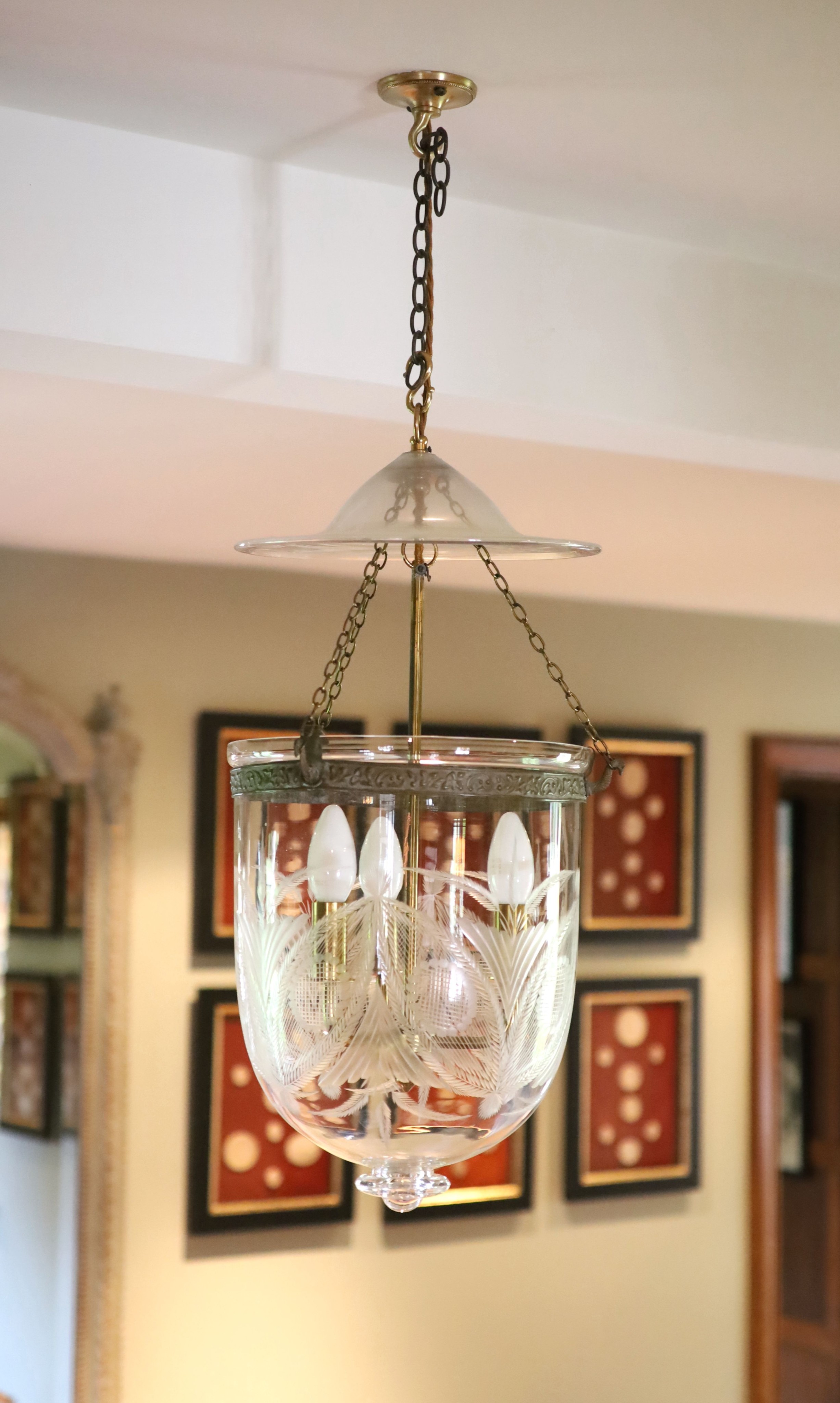 A cut and etched glass hurricane style ceiling light, height 54cm diameter 30cm, fitted for electricity